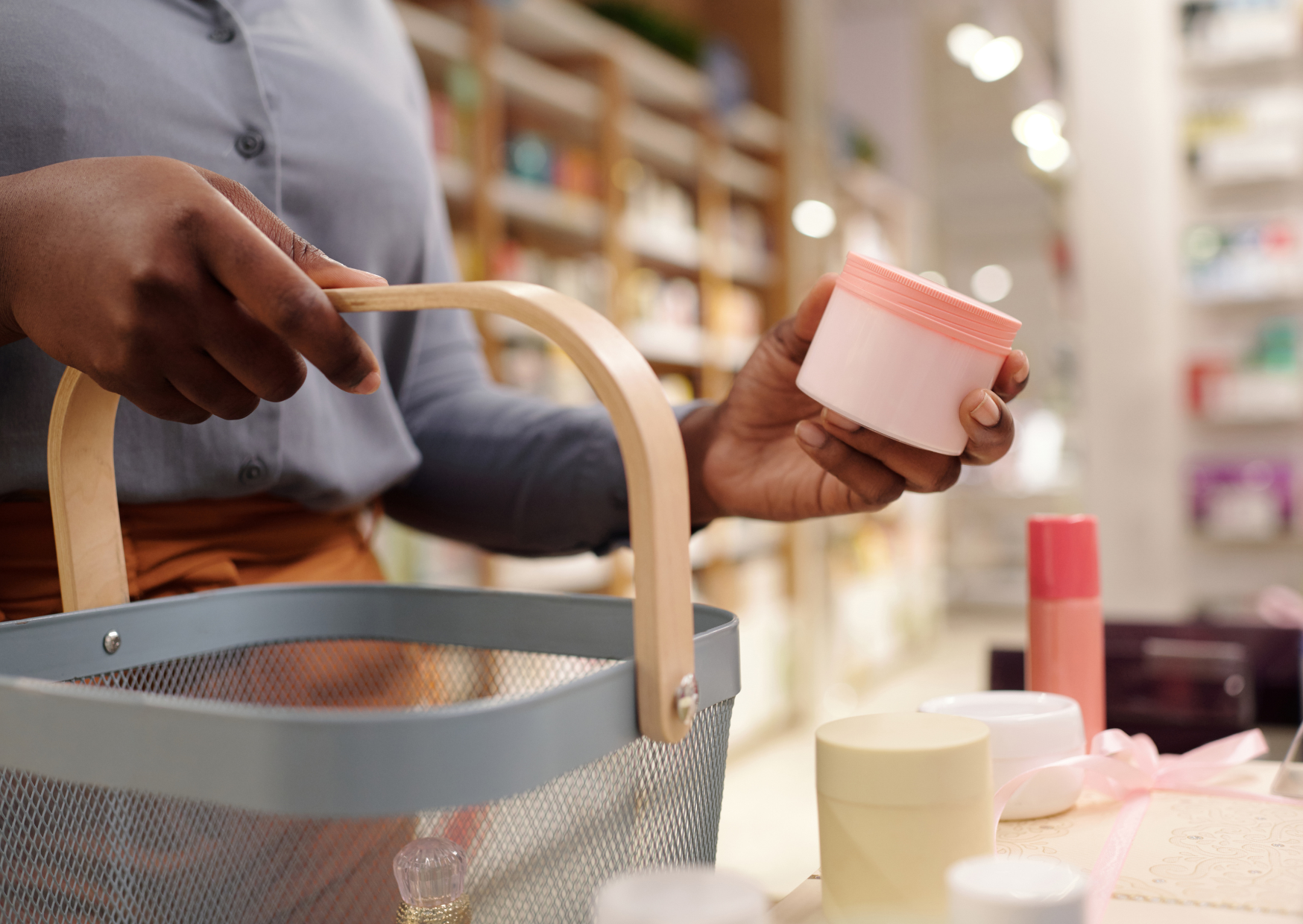 image of man holding a shopping basket and holding a non-descriptive round container